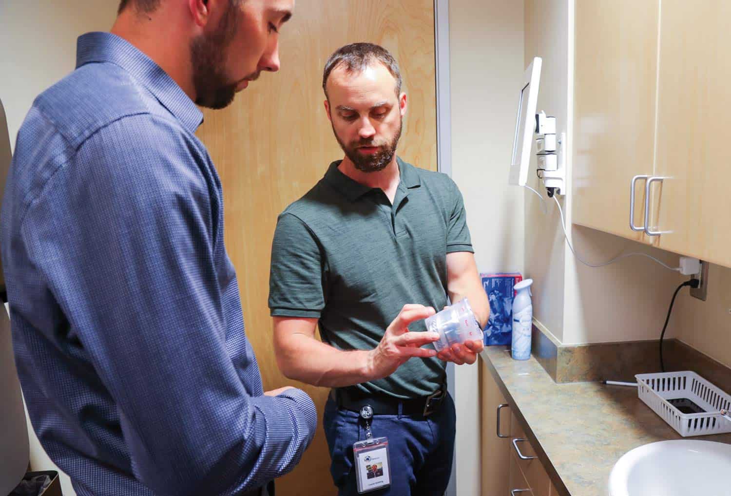 A staff member conducts drug screening at Beacon’s Cordova location.