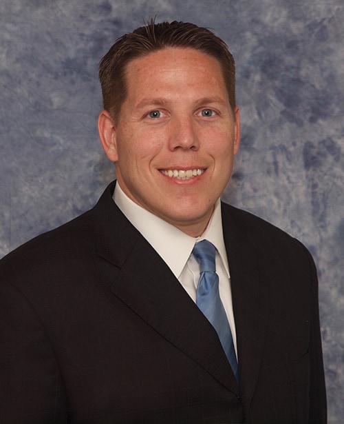 Erick Stoeckle Erick Stoeckle smiling in a professional portrait
