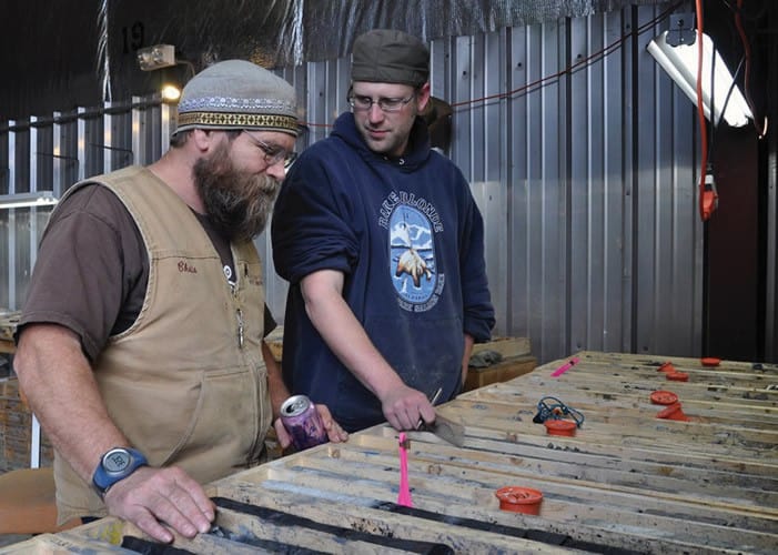 15_-Chris_Puchner_Chief_Geologist_looking_over_core