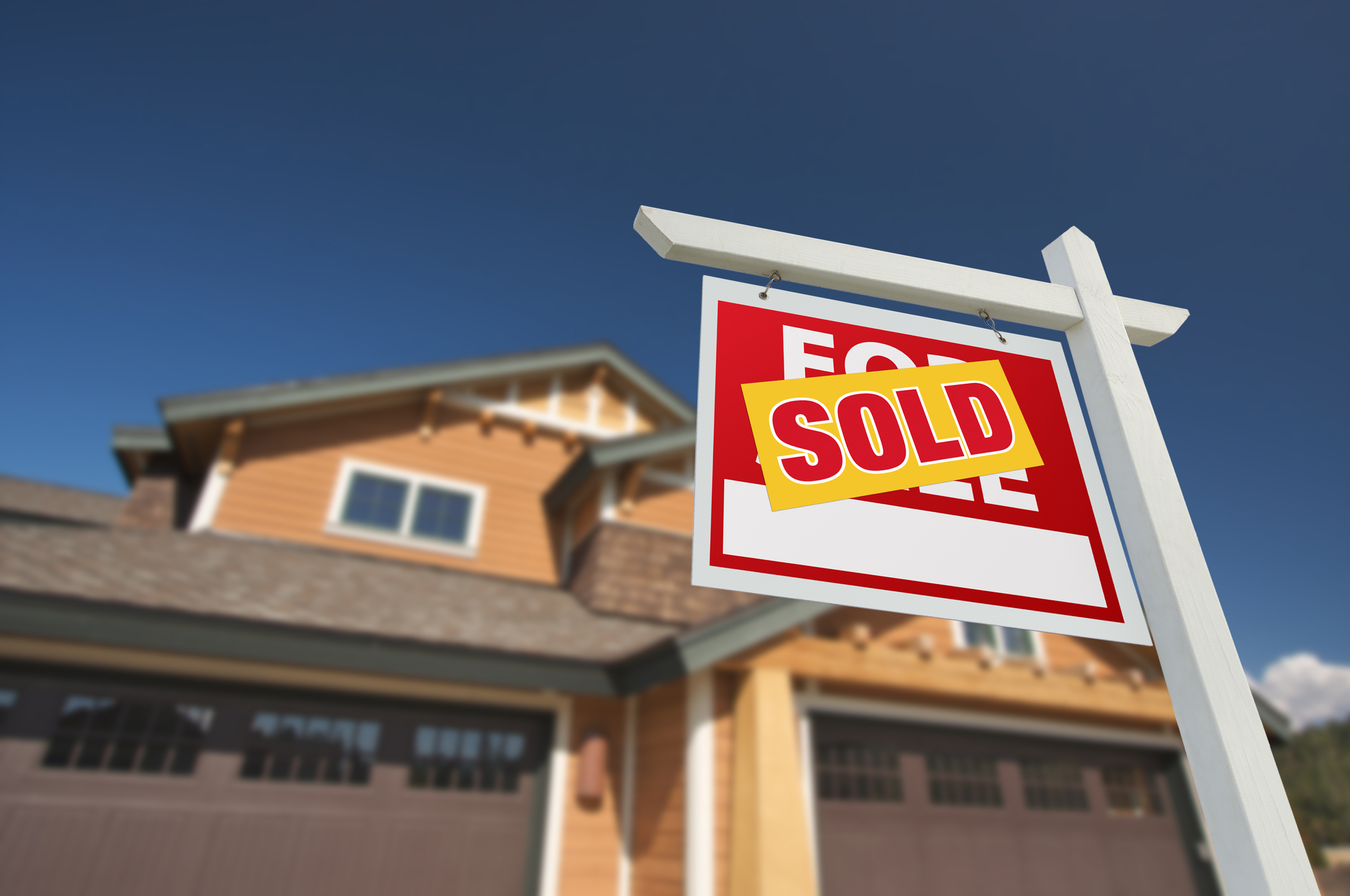 Sold Home For Sale Sign in Front of Home Sold Home For Sale Sign in Front of Home