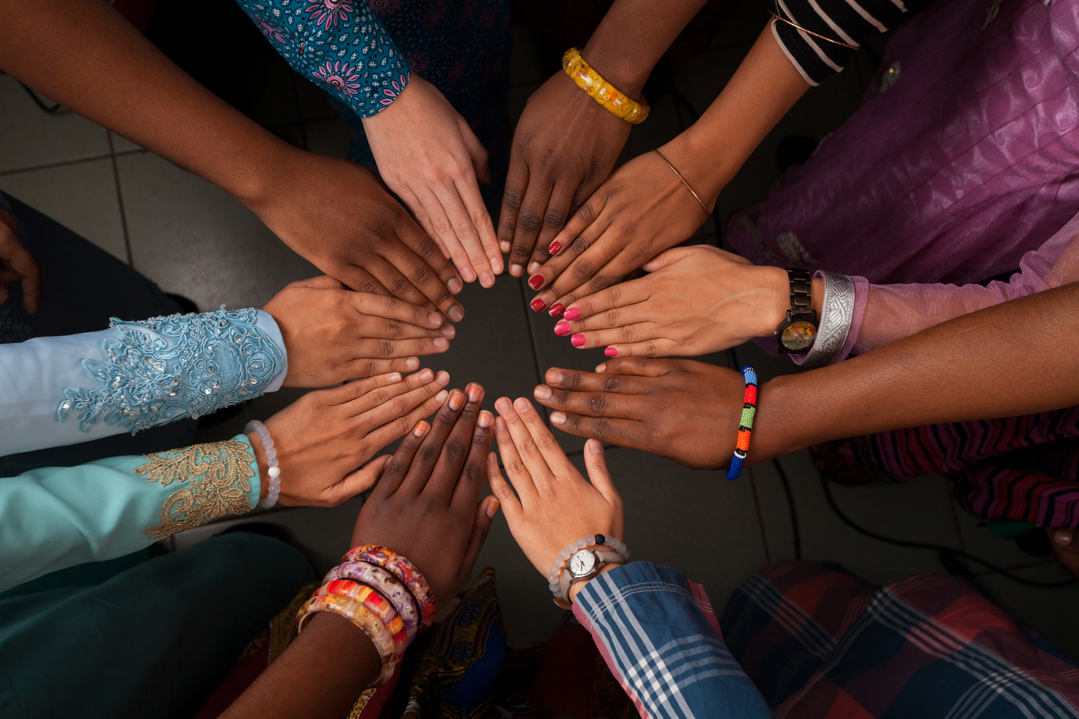 Happy hands of diverse people