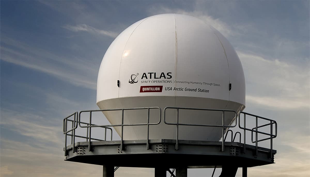 A tower with the ATLAS and Quintillion logo on it