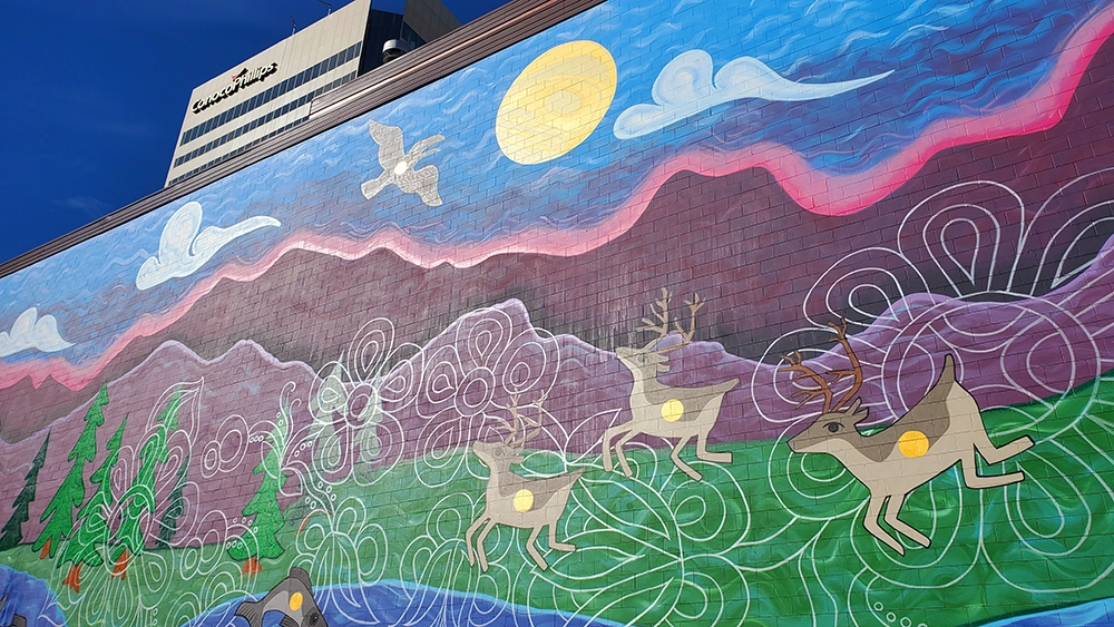  A recently completed mural decorates the east wall of 645 G Street