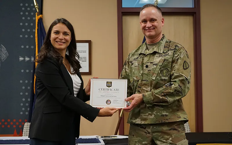 Lieutenant giving lady award