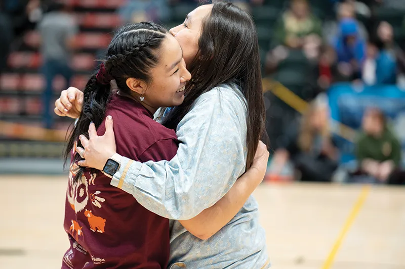 Eden Hopson hugs coach