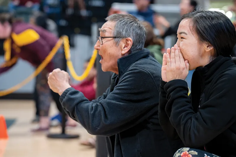 coach cheers on team members