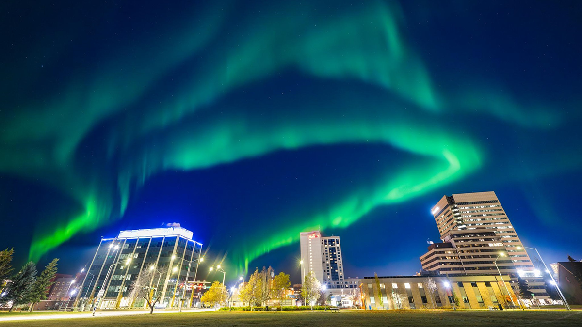 Bright green aurora borealis over downtown Anchorage